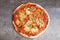 Pizza margherita on dark background. Traditional italian pizza, top view. Takeaway food