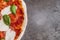 Pizza margherita on dark background. Traditional italian pizza, top view. Takeaway food