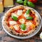 Pizza Margherita - green basil, mozzarella, tomato sauce.