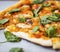 Pizza marguerita with spinach leaves, closeup, pizza with tomato