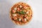 Pizza with mozzarella, avocado, shrimp, sesame and