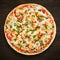 Pizza with mozzarella cheese, chicken, sweet corn, sweet pepper and parsley on dark wooden background top view