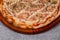 Pizza with Mushroom, ham and catupiry cheese  on gray background. top view