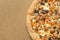 Pizza with mushrooms on corrugated fiberboard background