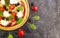 Pizza, olives, tomatoes  concrete background