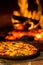 Pizza Oven Pizza shallow depth of field with hot fire
