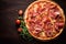 Pizza with prosciutto (parma ham) on dark wooden background
