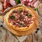 Pizza Restaurant Menu - Delicious Fresh Pizza with Sausage, Melt Meat and Chicken. Pizza on Rustic Wooden
