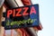 Pizza restaurant sign outside in france a emporter means to take away