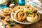 Pizza rolls puff pastry stuffed with prosciutto bacon, mushrooms and cheese on the Christmas table, italian appetizers