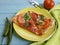 Pizza with a sausage closeup toasted food knife fork italian dinner vegetable on a wooden