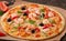 Pizza with shrimp, salmon and olives