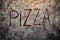 Pizza text on flour top view