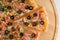Pizza top view cutted on 8 pieces and one pushed forward. Advert for pizzeria caffee and restaurant. Food delivery at