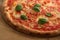 Pizza, typical italian food, still life, detail with basil