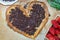 Pizza Valentine& x27;s Day, sweet dessert with chocolate and strawberries, with caramel sauce and chocolate. Step by step