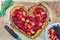 Pizza Valentine& x27;s Day, sweet dessert with chocolate and strawberries, with caramel sauce and chocolate. Step by step