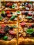 Pizza with white mushrooms, sausage, tomatoes, black olives, parmesan and mozzarella on wooden background