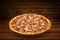 Pizza on wooden table. Flying hot pizza pepperoni closeup with mozzarella cheese and  steam smoke