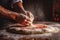 Pizzaiolo sprinkling flour onto a wooden surface and stretching pizza dough with both hands, illustrating the handmade and