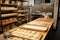 pizzeria prep station, with rolling pins and trays of fresh dough ready to be made into delicious pies