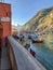 Pizzeria sign overlooks sunny harbor at Vernazza, Cinque Terre,