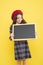 Place for information. Girl hold blank blackboard. Advertising product copy space. Back to school concept. School