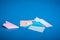 Place for making origami paper planes. Blue, blue, pink origami airplanes crafts