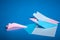 Place for making origami paper planes. Blue, blue, pink origami airplanes crafts.