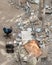 Place with pile of discarded rubbish near abandoned building at sunny day. wreckage and ruins of destroyed building