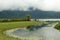 Place of prayer and power. Bratan lake in fog. Traditional balinese ritual offerings in straw baskets for Hindu spirits and gods