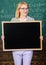 Place for school advertisement. Official advertisement concept. Teacher hold blackboard blank advertisement copy space