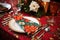 place settings with holiday-themed napkins