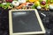 A place to write your own menu or recipe - blackboard, chalk and lots of fruits, vegetables and herbs