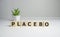 Placebo word written on blocks. Placebo effect, fake medical treatment