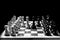 placed chess pieces on a dark background, the concept of confrontation, fair and unfair play, political games, rivalry