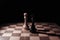 placed chess pieces on a dark background, the concept of confrontation, fair and unfair play, political games, rivalry