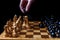 Placed chess pieces on a dark background, the concept of confrontation, fair and unfair play, political games, rivalry in business