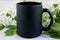 Placeit-Black coffee mug mockup with spring apple blossom