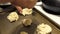 Placing biscuit dough on baking sheet