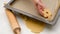 Placing cookies on baking pan lined with parchment paper