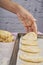 Placing cookies on the baking sheet with a greaseproof paper