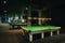 Placing snooker balls on a green billiard table
