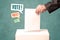 Placing a voting slip into a ballot box