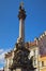 Plague Column in the main square of the medieval city Loket. Blue sky in the background