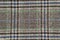 Plaid wool fabric background. Amazing texture of warm textile for winter coats.