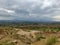 plain hills eith beautiful little greenery under beautiful white  sky