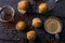 Plain mini muffins with chocolate chips on dark grey background