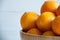 Plain orange mandarins on a grey background