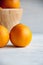 Plain orange mandarins on a grey background